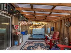 Sunken hot tub on covered deck -