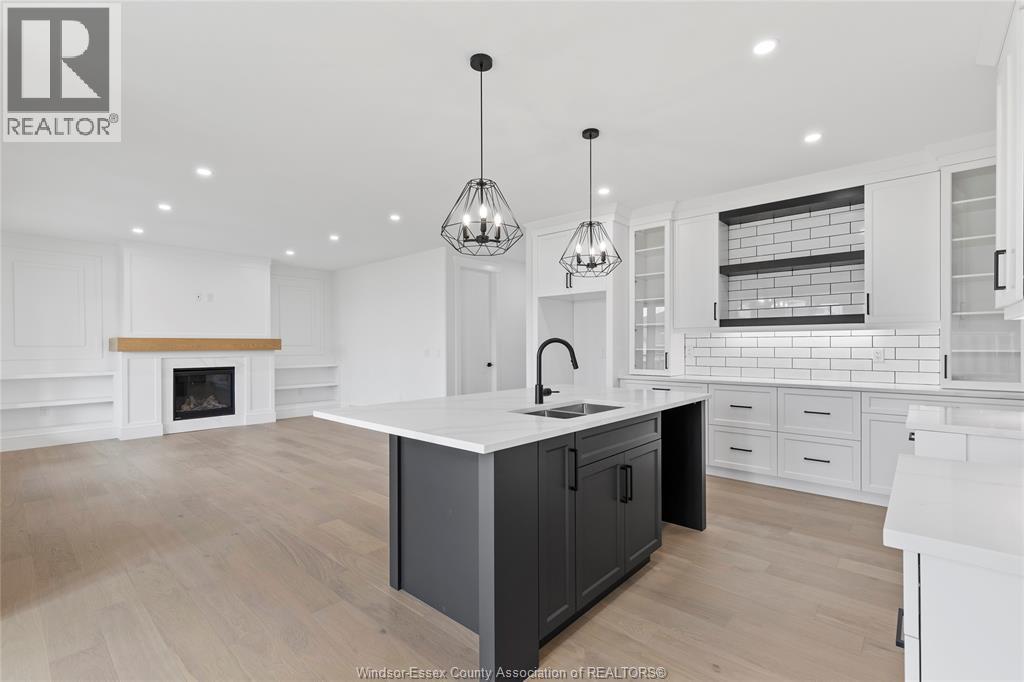 7355 Garnet, Mcgregor, ON - Indoor Photo Showing Kitchen With Fireplace With Double Sink With Upgraded Kitchen