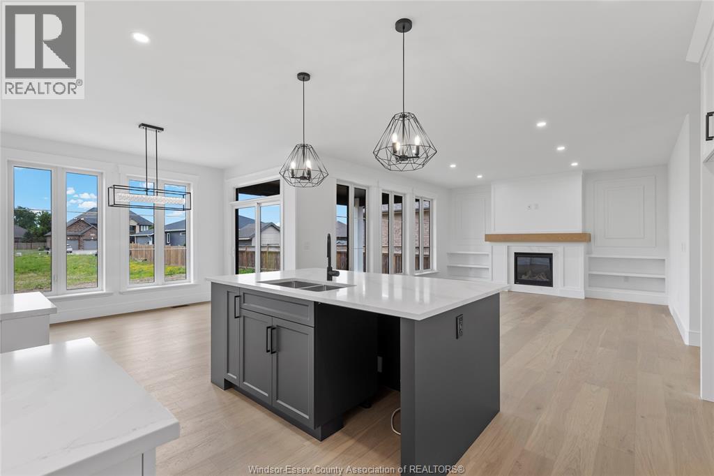 7355 Garnet, Mcgregor, ON - Indoor Photo Showing Kitchen With Fireplace With Double Sink With Upgraded Kitchen