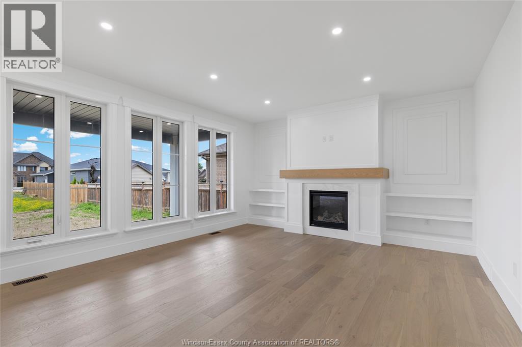 7355 Garnet, Mcgregor, ON - Indoor Photo Showing Living Room With Fireplace