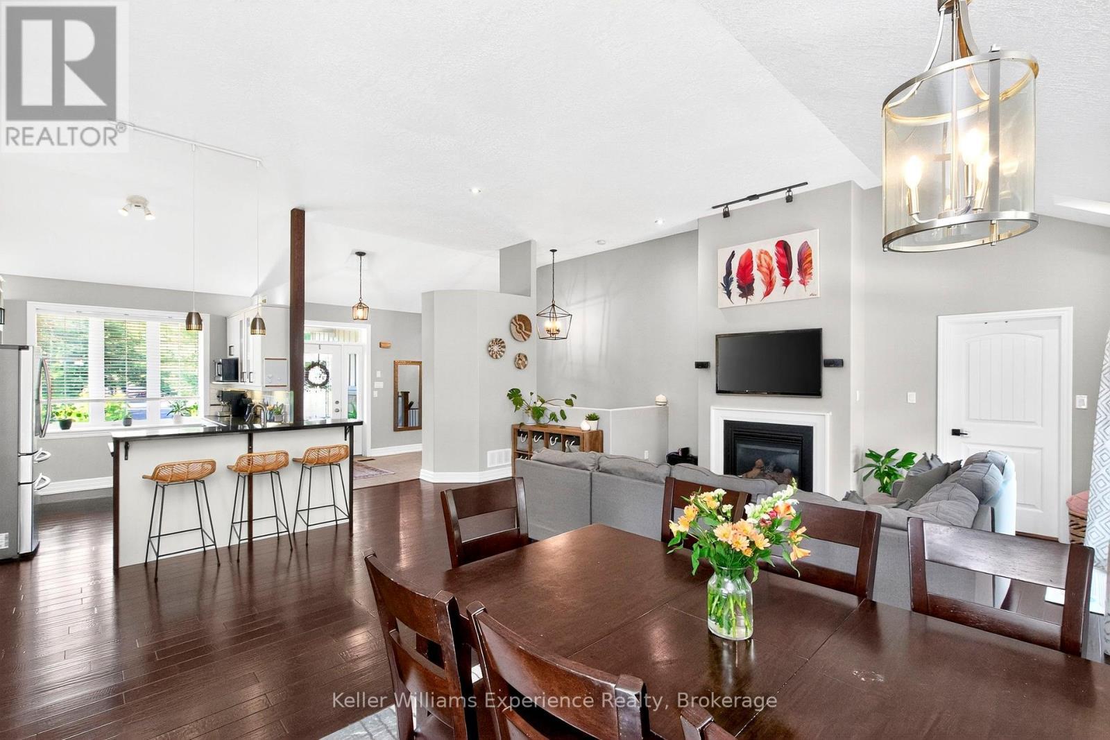 94 Windermere Circle, Tay, ON - Indoor Photo Showing Dining Room With Fireplace