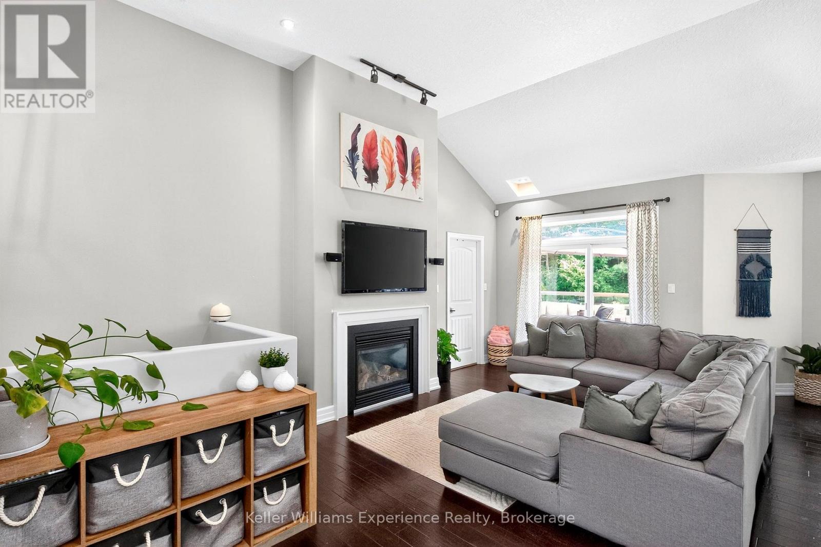 94 Windermere Circle, Tay, ON - Indoor Photo Showing Living Room With Fireplace