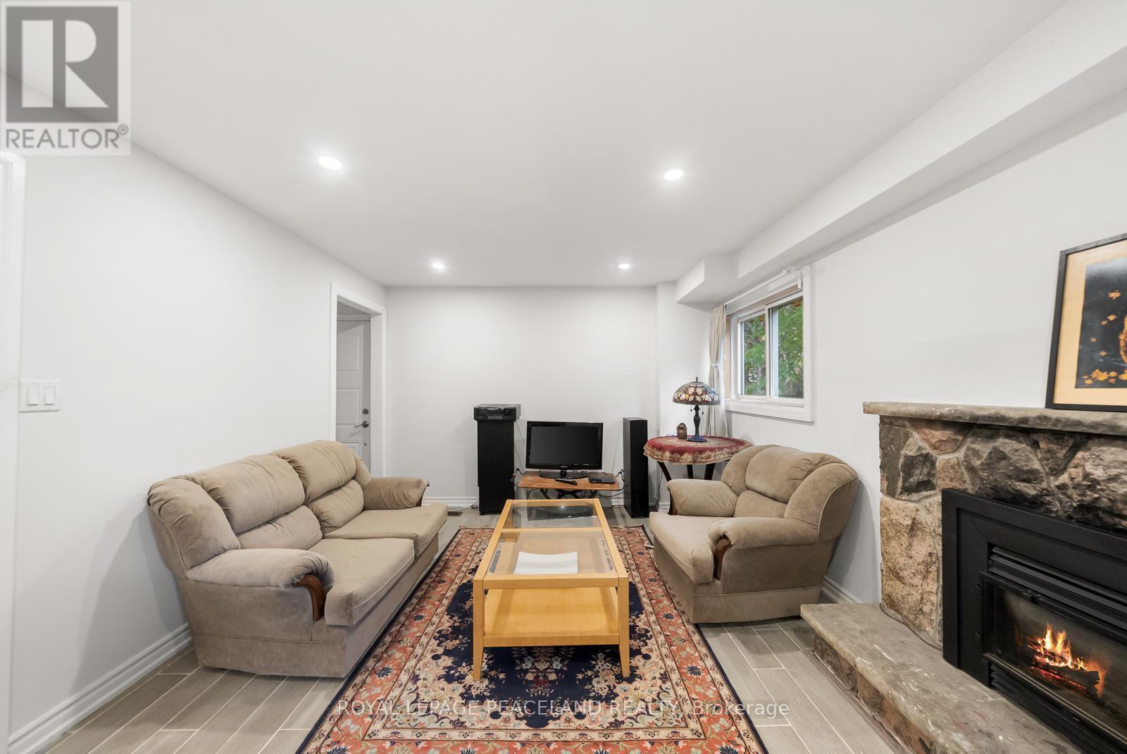 105 Apache Trail, Toronto, ON - Indoor Photo Showing Living Room With Fireplace
