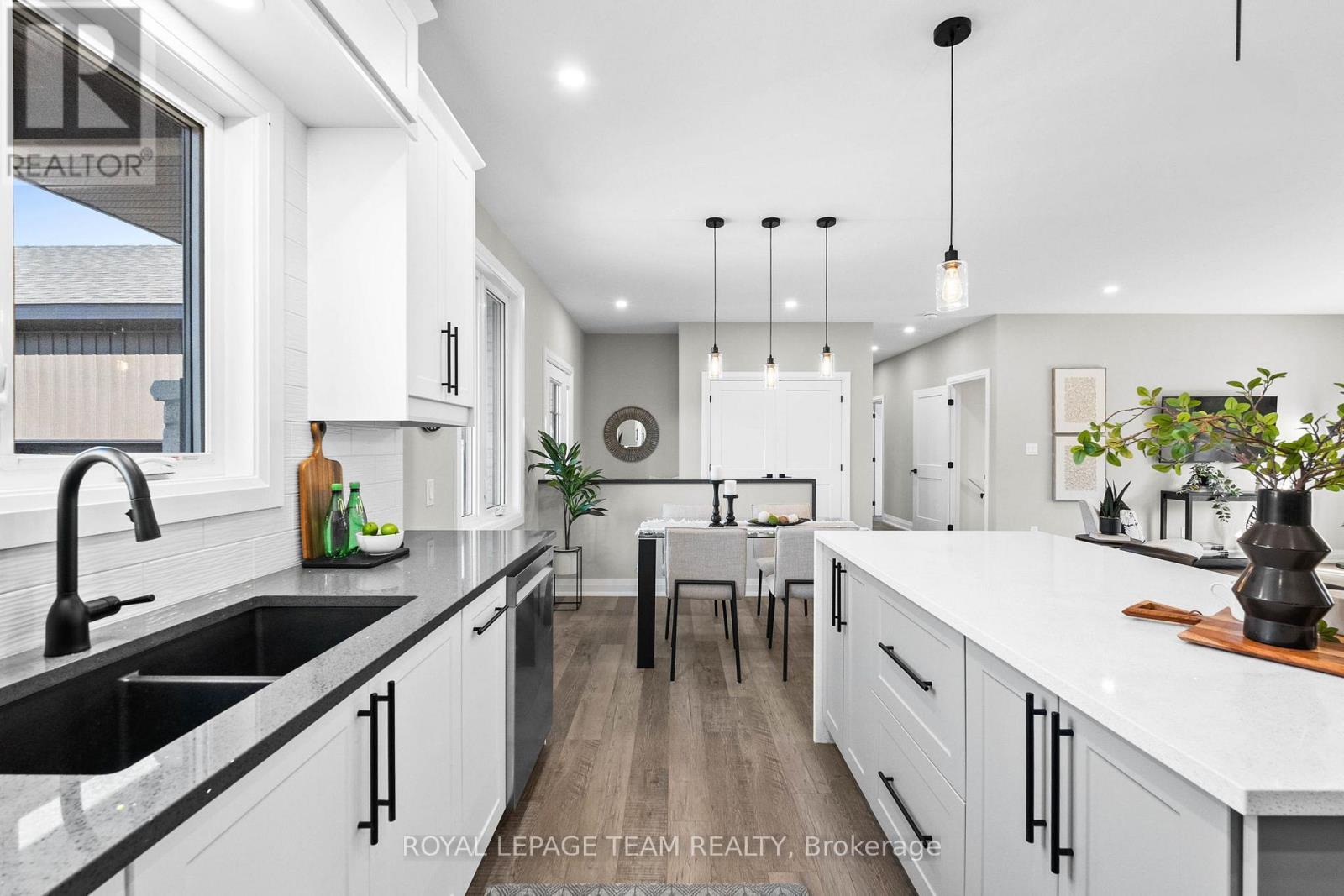 Contrasting Quartz counters add style - 2850 Montague Boundary Road, Ottawa, ON - Indoor Photo Showing Kitchen With Double Sink With Upgraded Kitchen