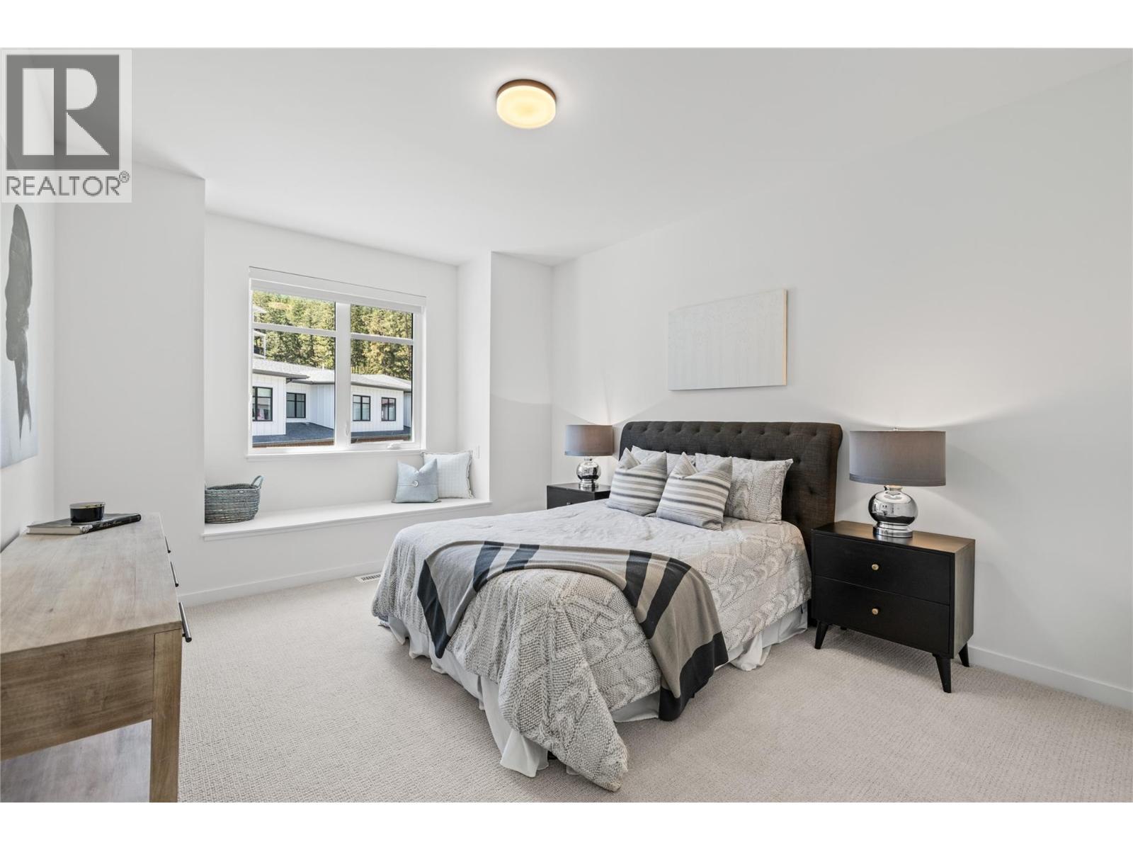 Third bedroom -Photo of a similar home in the community. - 1979 Country Club Drive Unit# 9, Kelowna, BC - Indoor Photo Showing Bedroom