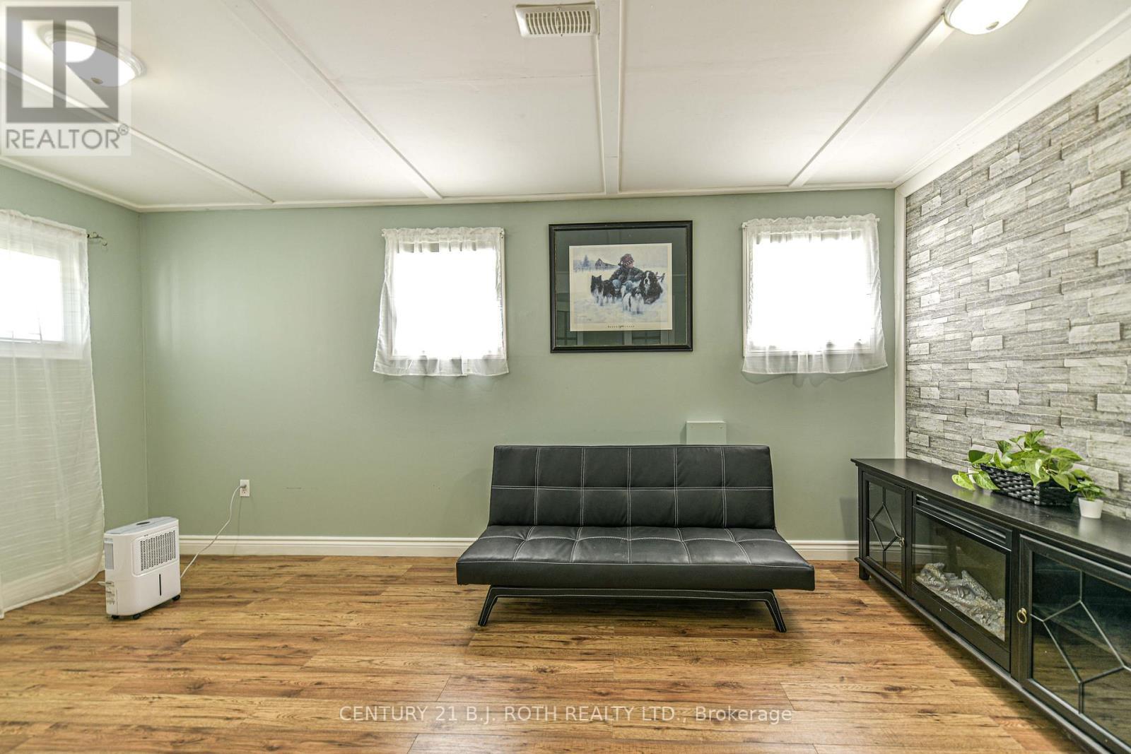 Bedroom 3 - 7576 Cronk Side Road, Ramara, ON - Indoor With Fireplace