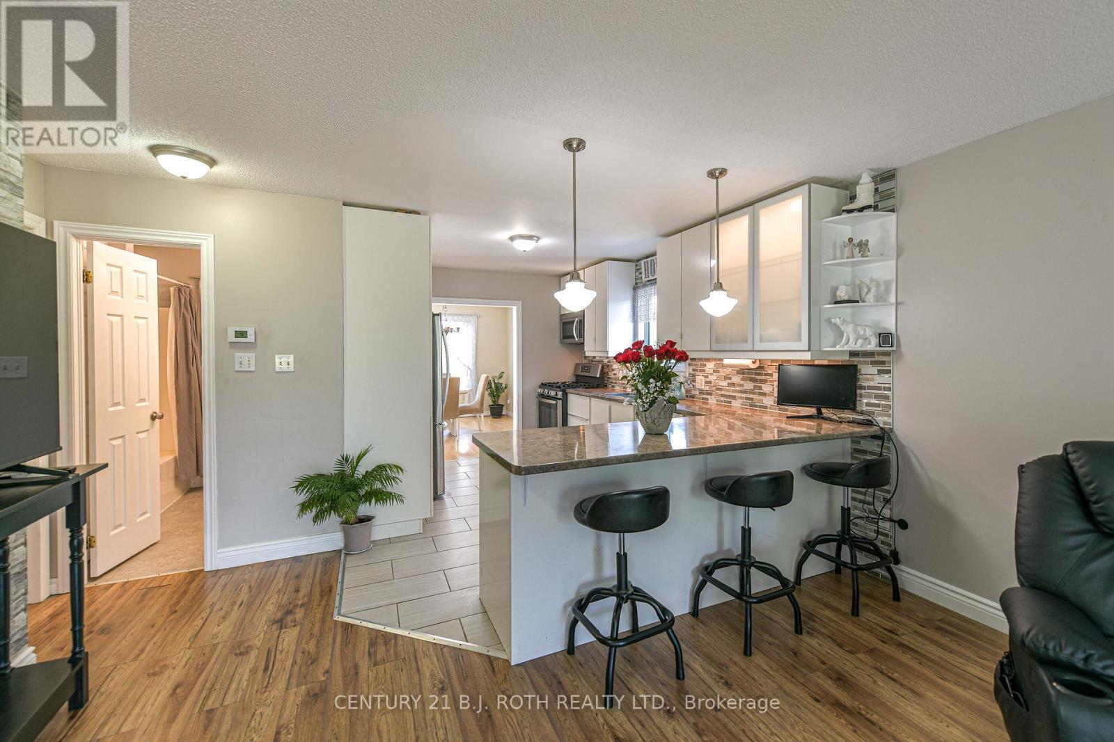 Peninsula That Extends And Has Seating - 7576 Cronk Side Road, Ramara, ON - Indoor Photo Showing Kitchen With Upgraded Kitchen