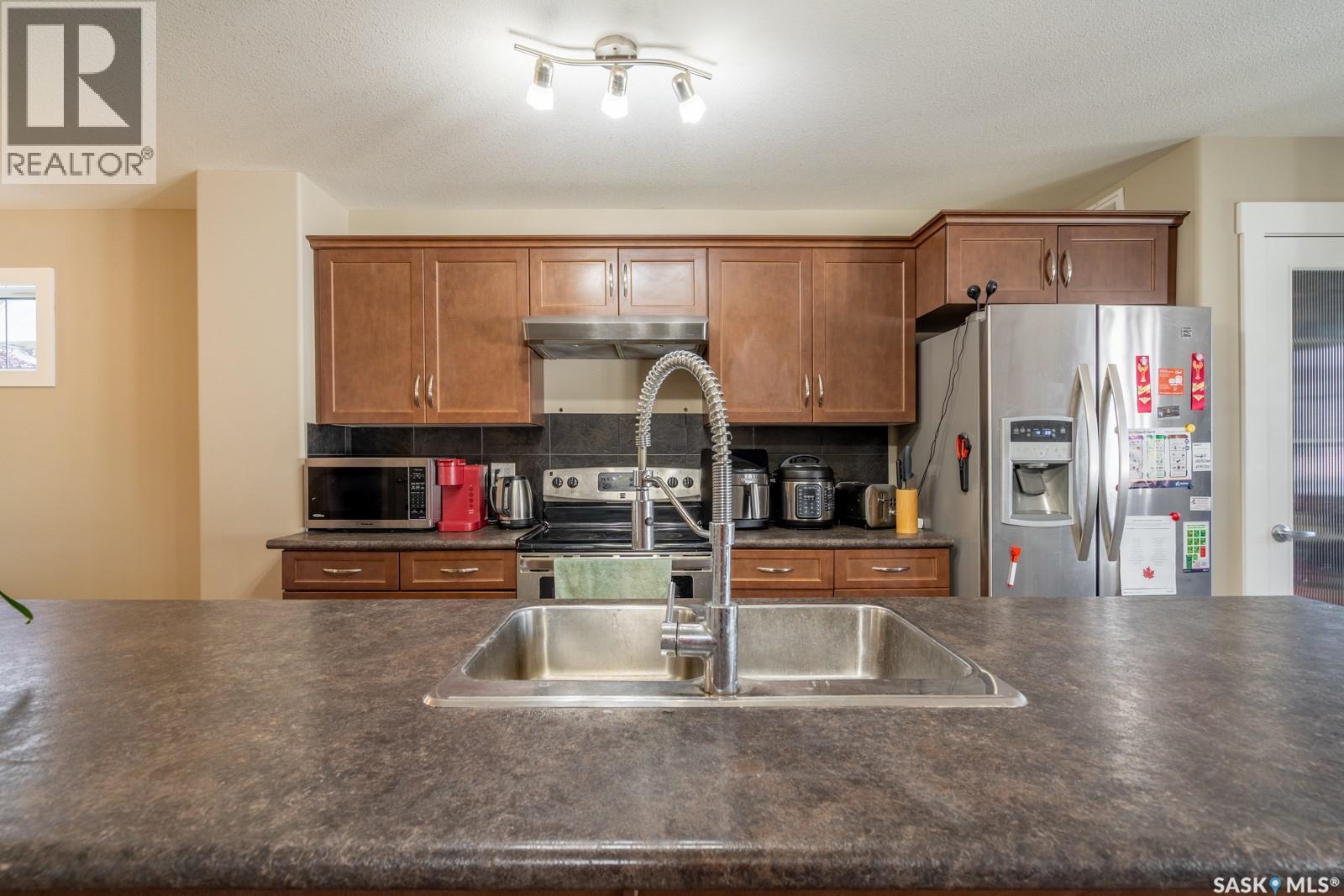 3669 Green Bank Road, Regina, SK - Indoor Photo Showing Kitchen With Double Sink
