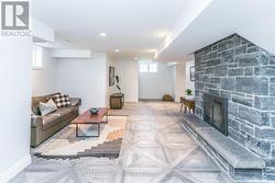 SPACIOUS LOWER LEVEL WITH STONE FIREPLACE -