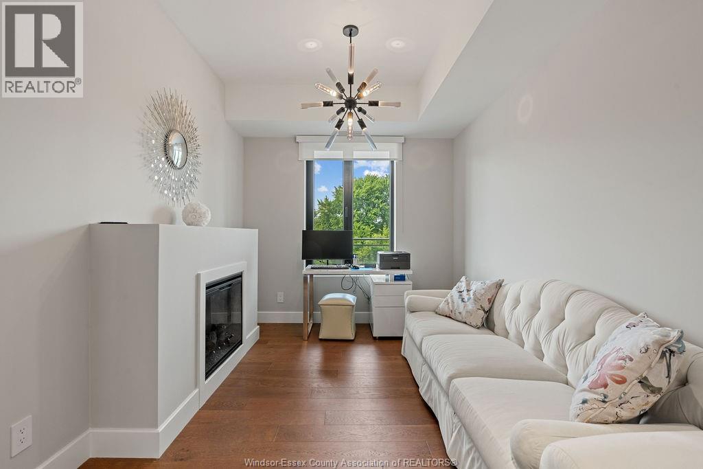 14400 Tecumseh Road Unit# 209, Tecumseh, ON - Indoor Photo Showing Living Room With Fireplace