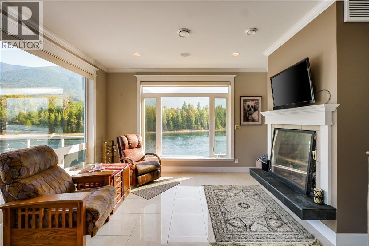 48-7126 Highway 3A Highway, Nelson, BC - Indoor Photo Showing Living Room With Fireplace