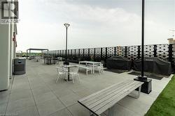 View of patio featuring area for grilling -