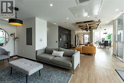 Community lobby with recessed lighting and electric panel -