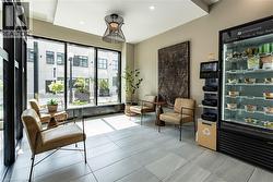 Sitting room with recessed lighting and light tile patterned flooring -