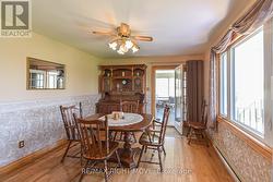 Main level dining room leading to attached sunroom -