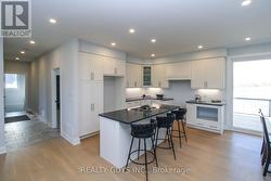KITCHEN----HALLWAY TO PRIMARY BEDROOM, LAUNDRY.... -