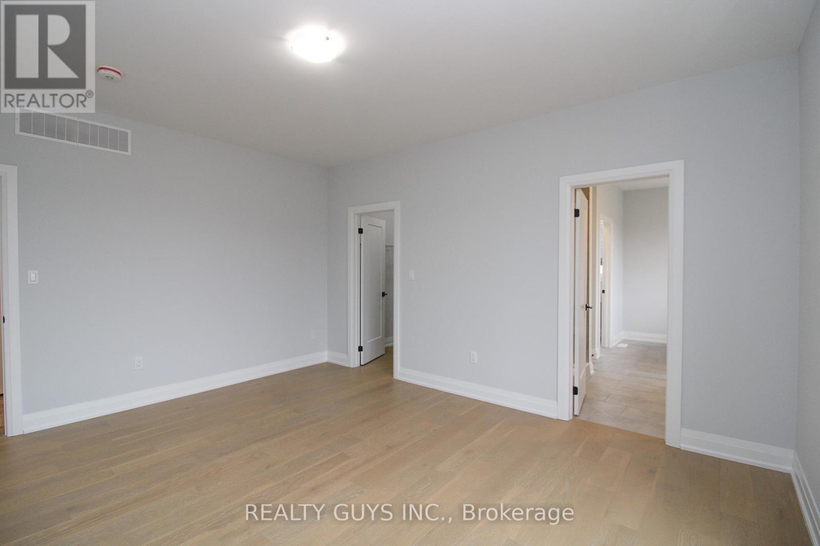 PRIMARY BEDROOM-W/I CLOSET ON LEFT, 5 PC ENSUITE - 2418 Gwendolyn Court, Cavan Monaghan (Cavan Twp), ON - Indoor Photo Showing Other Room