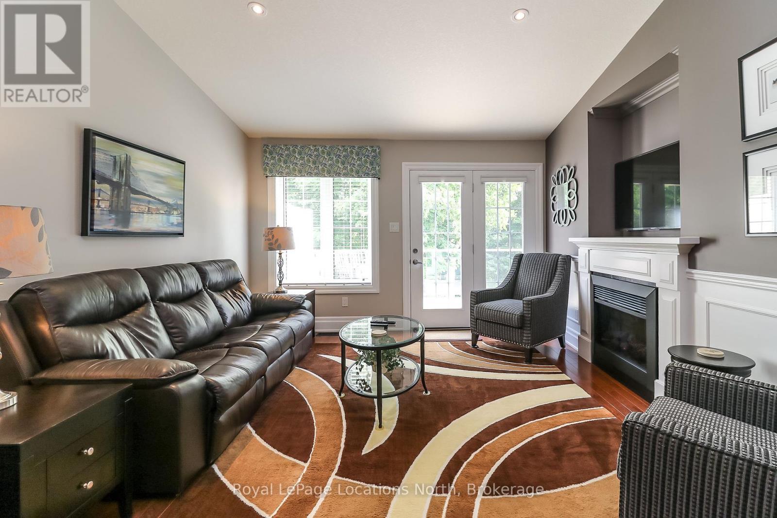 67 Greenway Drive, Wasaga Beach, ON - Indoor Photo Showing Living Room With Fireplace