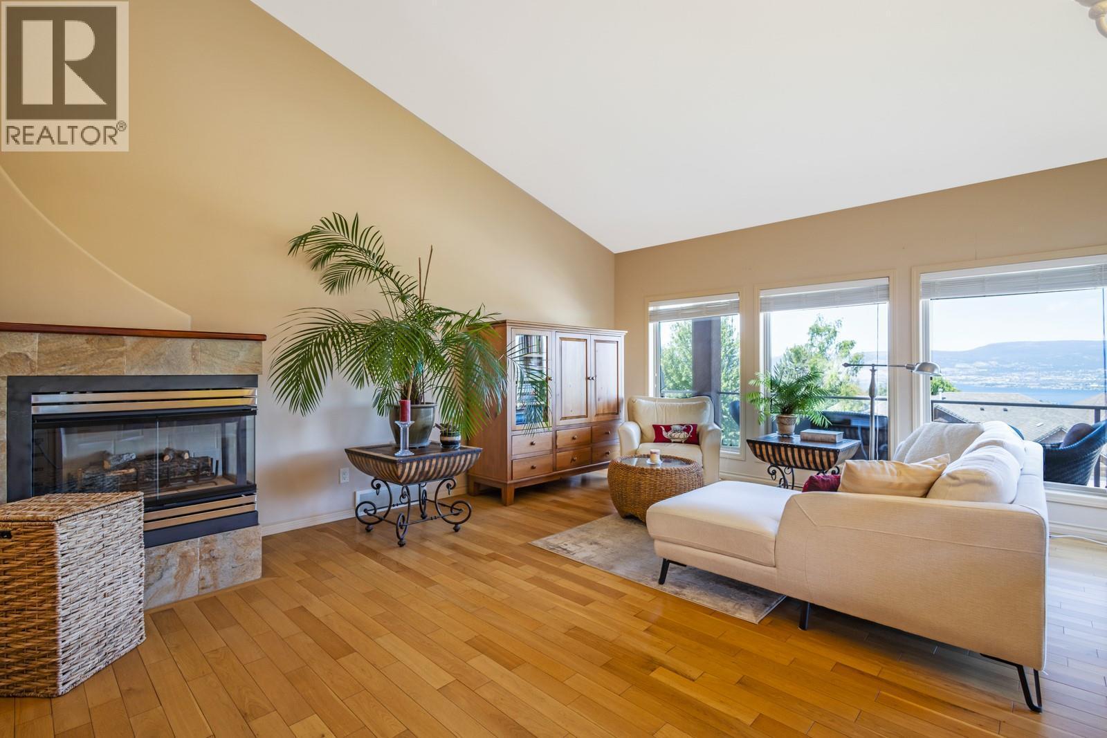 610 Arrowleaf Lane, Kelowna, BC - Indoor Photo Showing Living Room With Fireplace