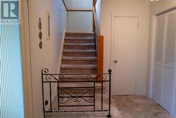Staircase to second floor from foyer -