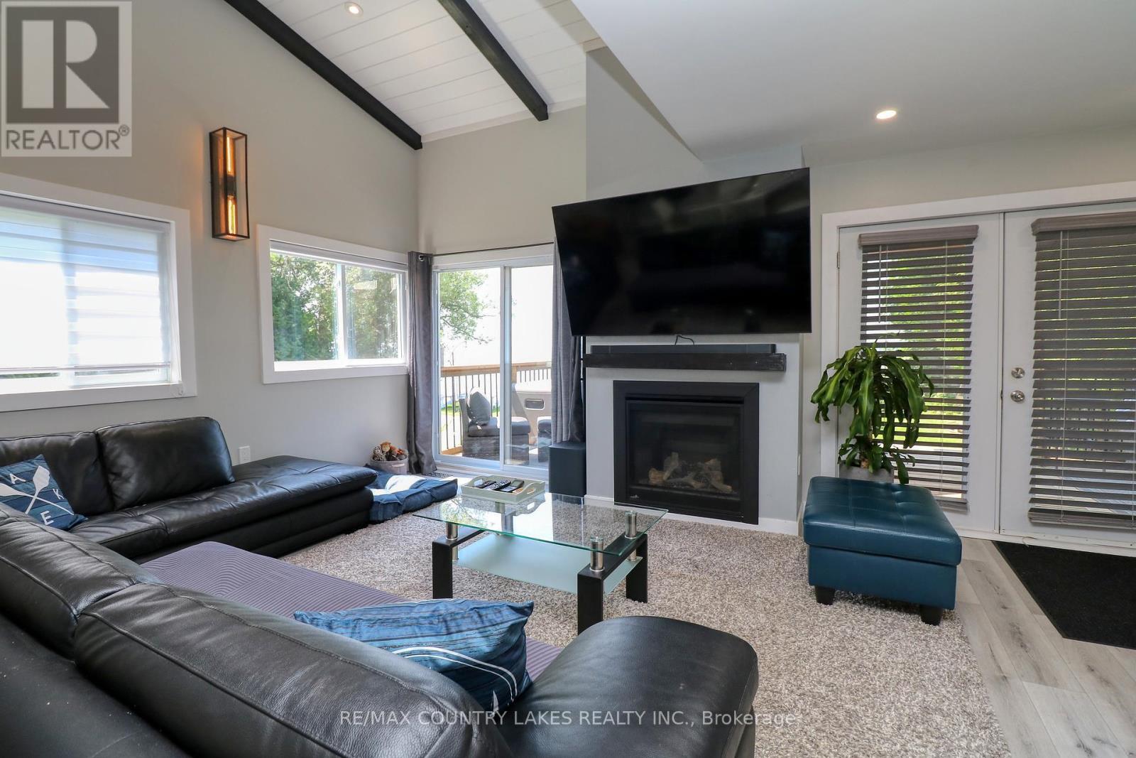 104 The Steps Road, Ramara, ON - Indoor Photo Showing Living Room With Fireplace