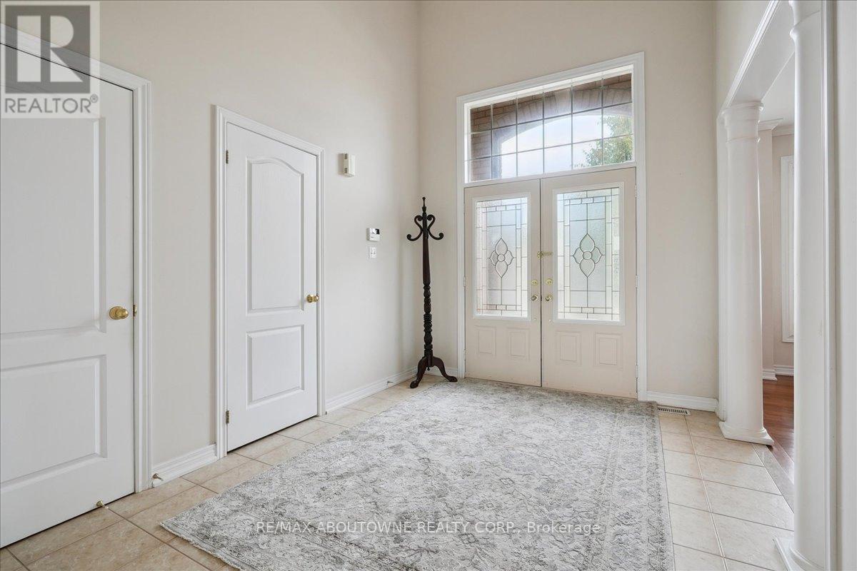Double door entryway, to spacious bright foyer . - 2348 Tesla Crescent, Oakville, ON - Indoor Photo Showing Other Room