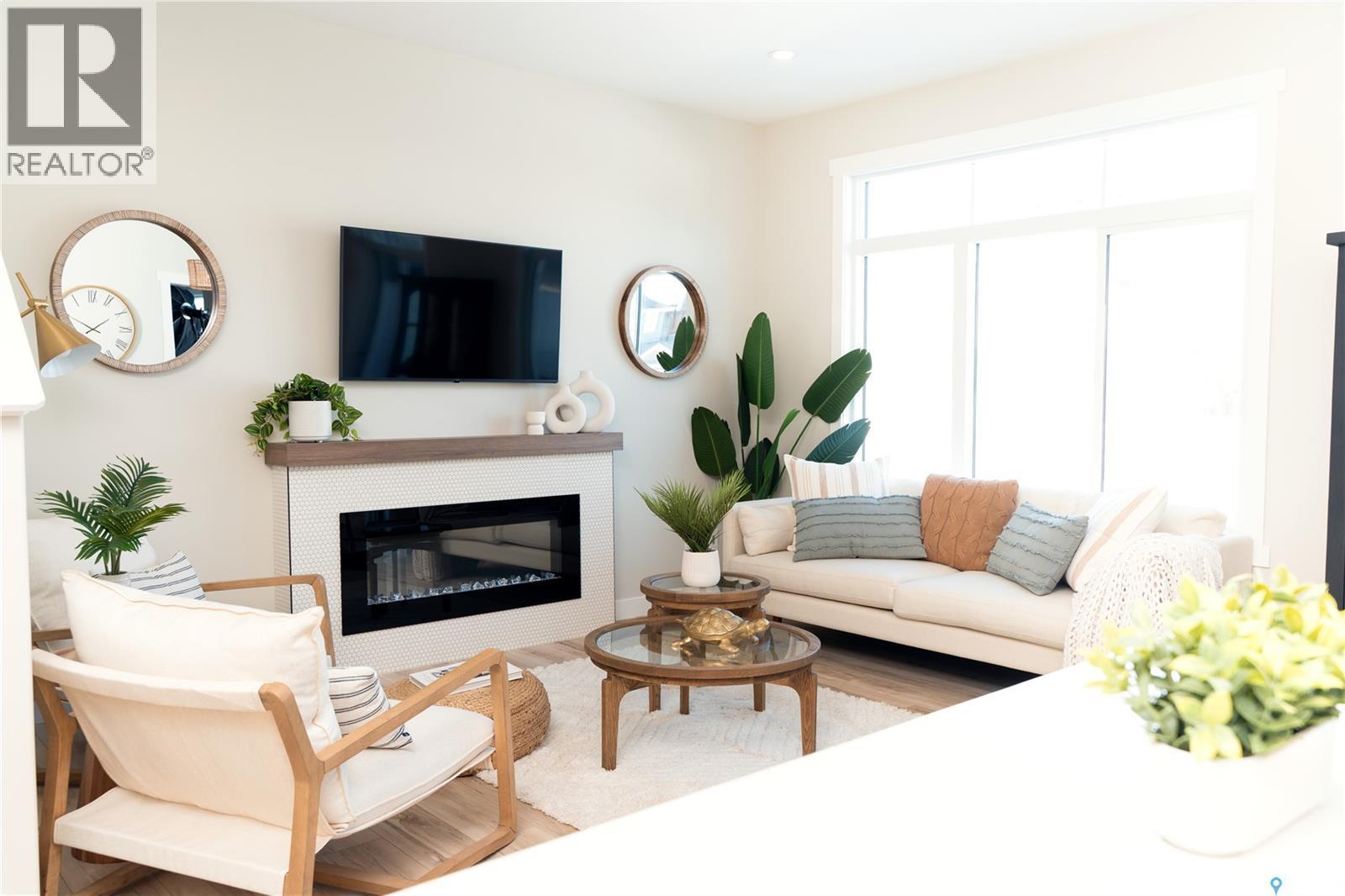 107 Fortosky Manor, Saskatoon, SK - Indoor Photo Showing Living Room With Fireplace
