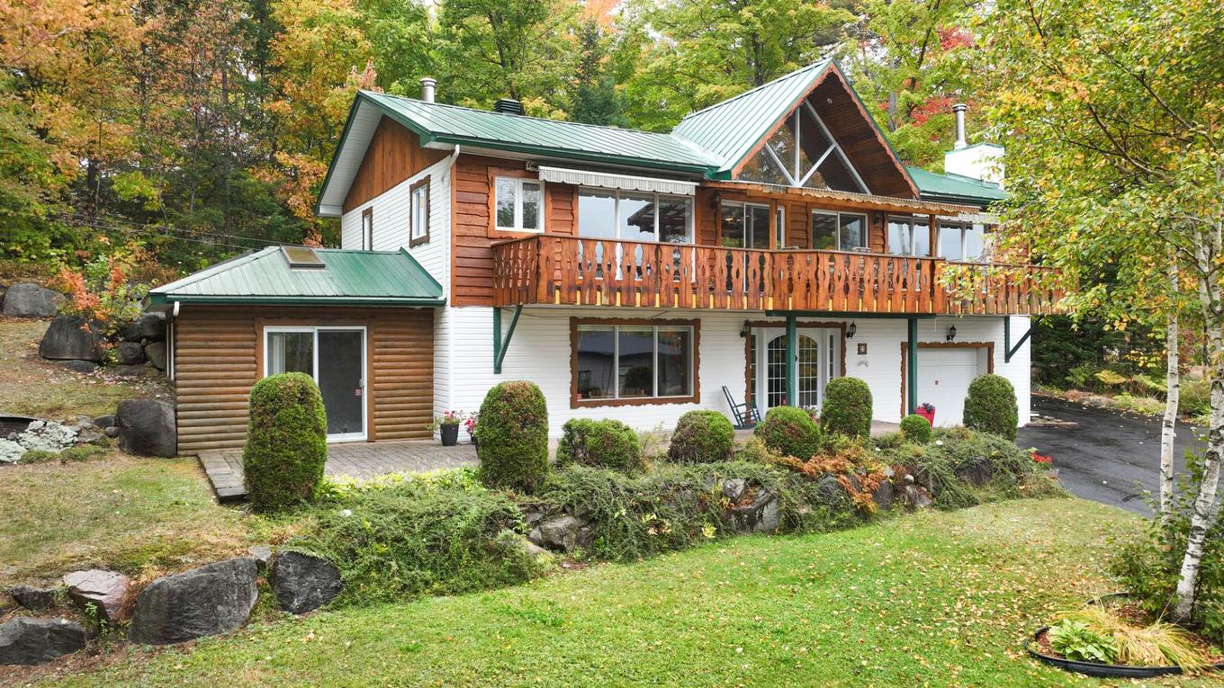 Façade - 21 Rue Du Domaine-Dancoste, Sainte-Marguerite-Du-Lac-Masson, QC - Outdoor With Deck Patio Veranda With Facade