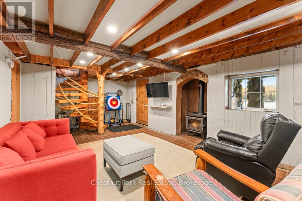 893 Relative Road, Armour, ON - Indoor With Fireplace