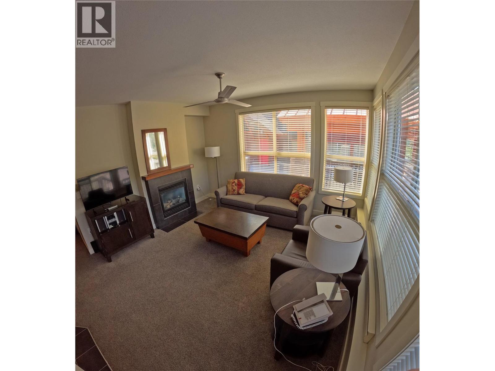 2049 Summit Drive Unit# 212A, Panorama, BC - Indoor Photo Showing Living Room With Fireplace