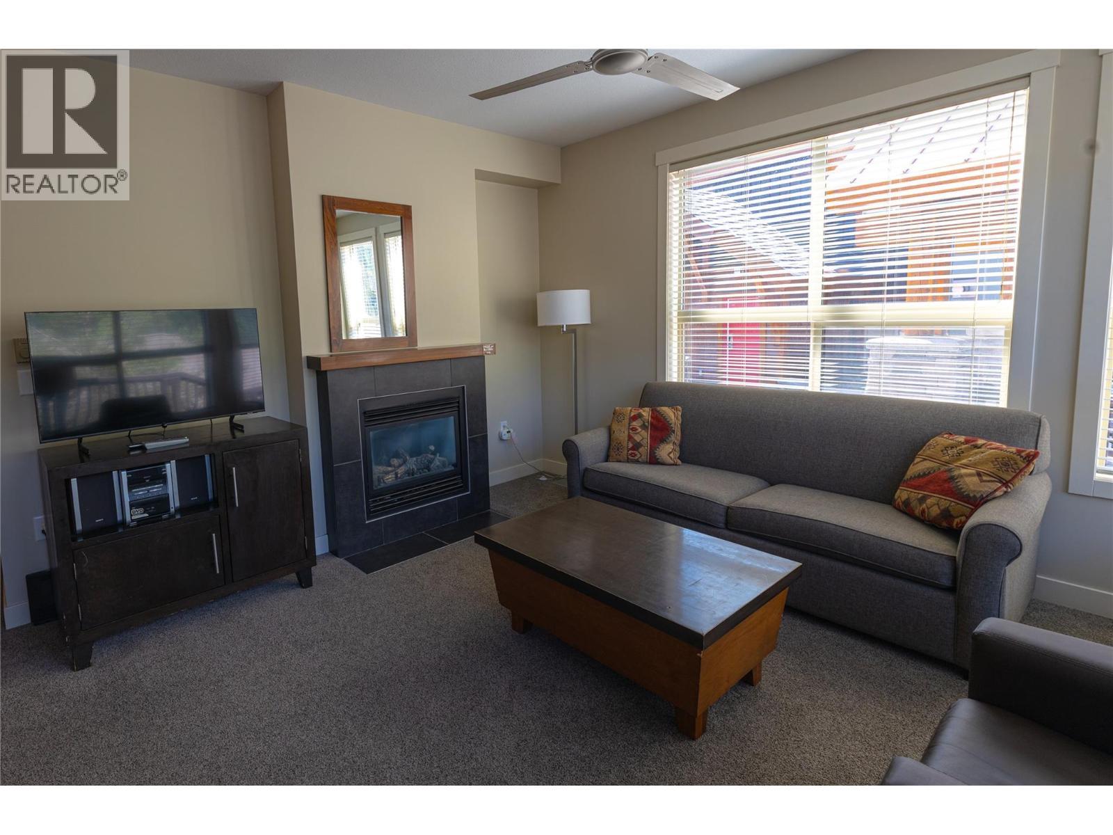 2049 Summit Drive Unit# 212A, Panorama, BC - Indoor Photo Showing Living Room With Fireplace