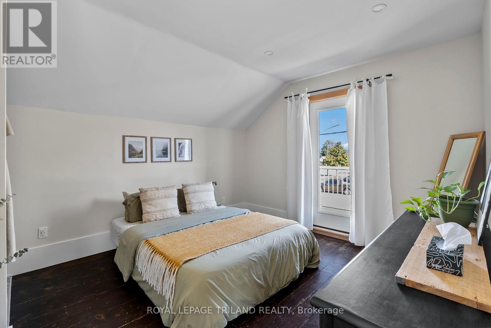 2nd storey: Primary bedroom, and door to balcony - 71 Huron Street, Huron-Kinloss, ON - Indoor Photo Showing Bedroom