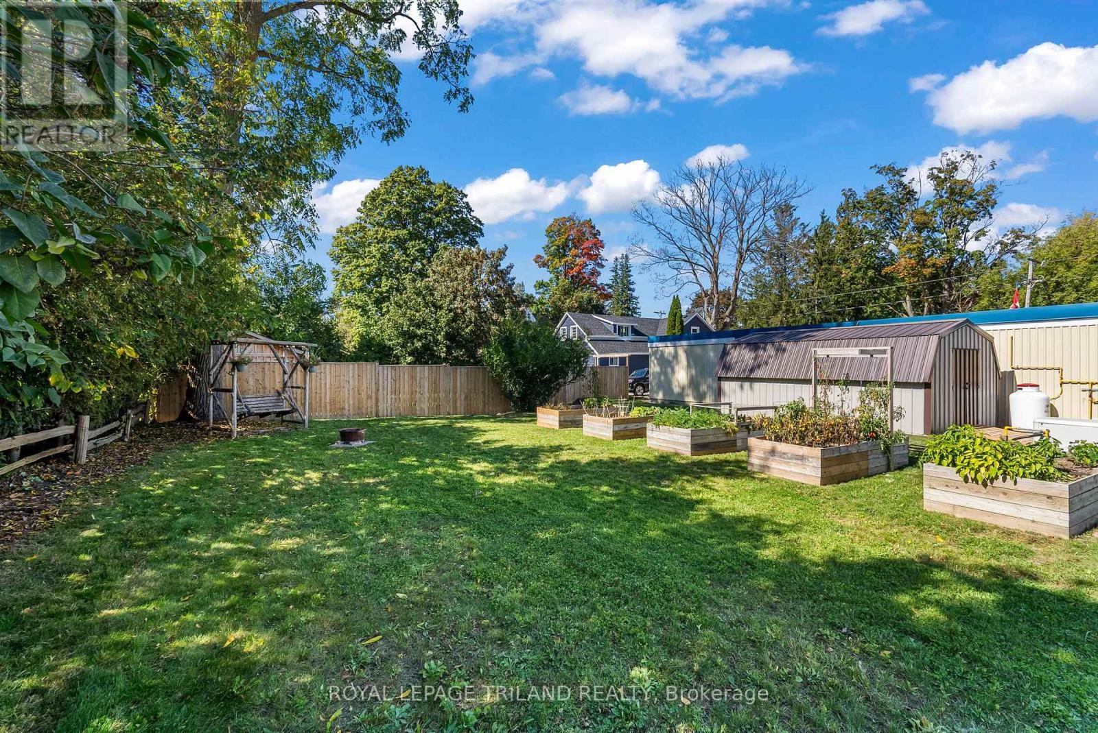 Back garden. Neighbour's shed - 71 Huron Street, Huron-Kinloss, ON - Outdoor With Backyard