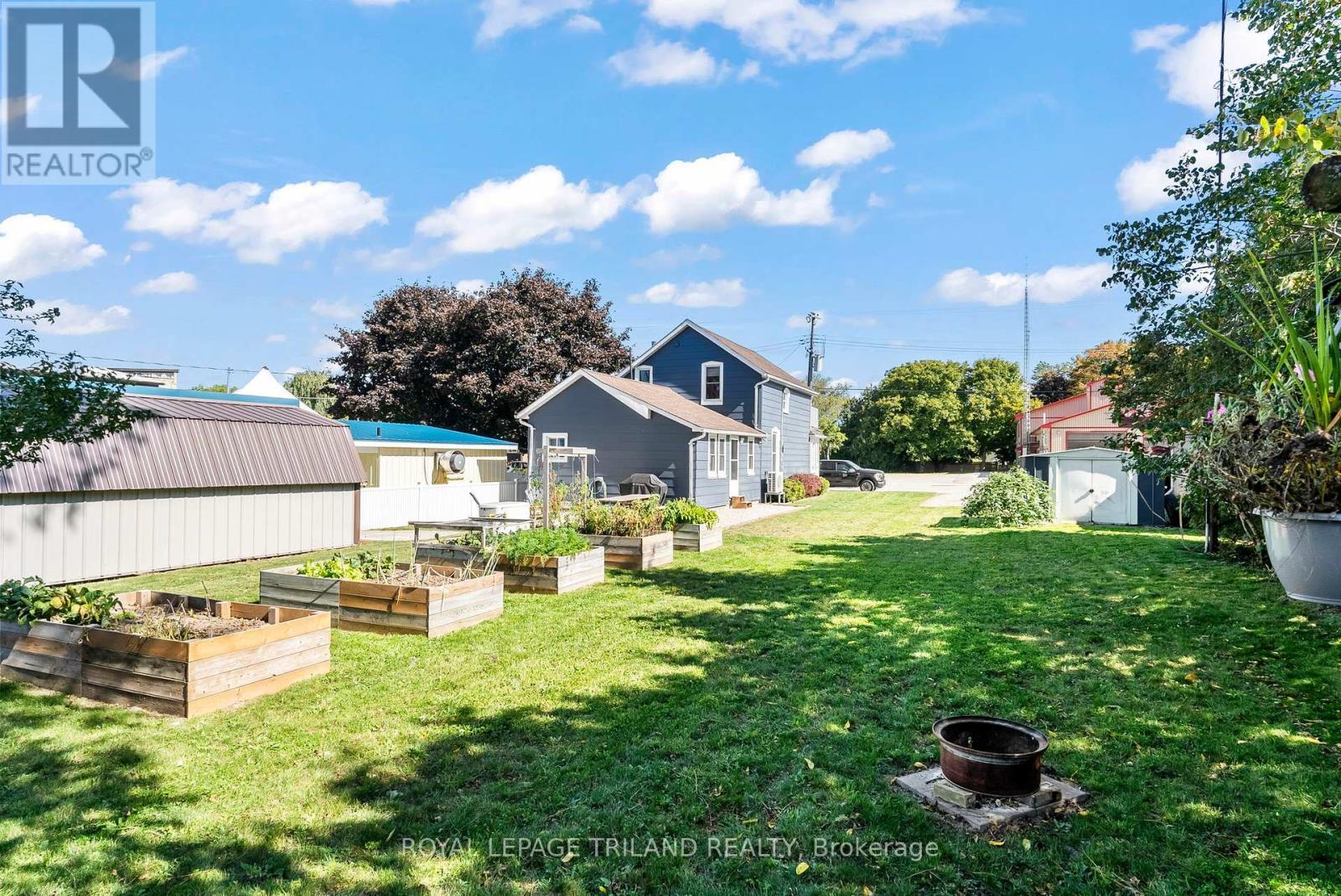Back garden. Neighbour shed (L), owned shed (R) - 71 Huron Street, Huron-Kinloss, ON - Outdoor