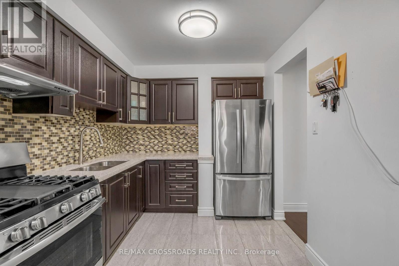 12 - 7450 Darcel Avenue, Mississauga, ON - Indoor Photo Showing Kitchen With Stainless Steel Kitchen With Double Sink With Upgraded Kitchen