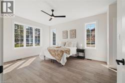 Bedroom featuring light wood-type flooring and ceiling fan -