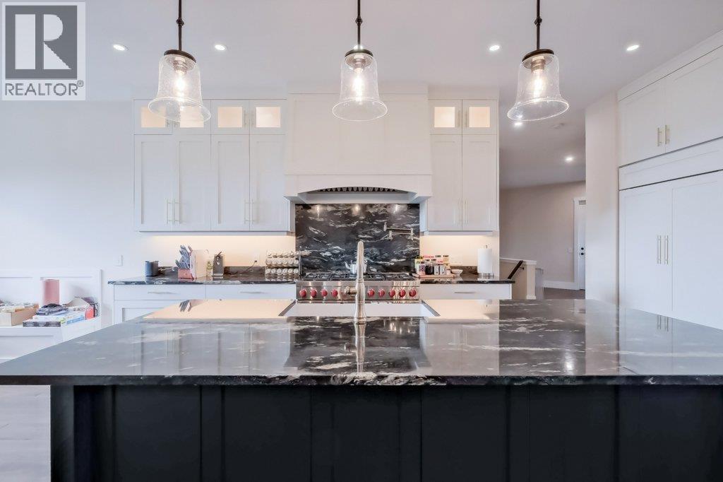 7839 Falcon Ridge Crescent, Kelowna, BC - Indoor Photo Showing Kitchen With Upgraded Kitchen