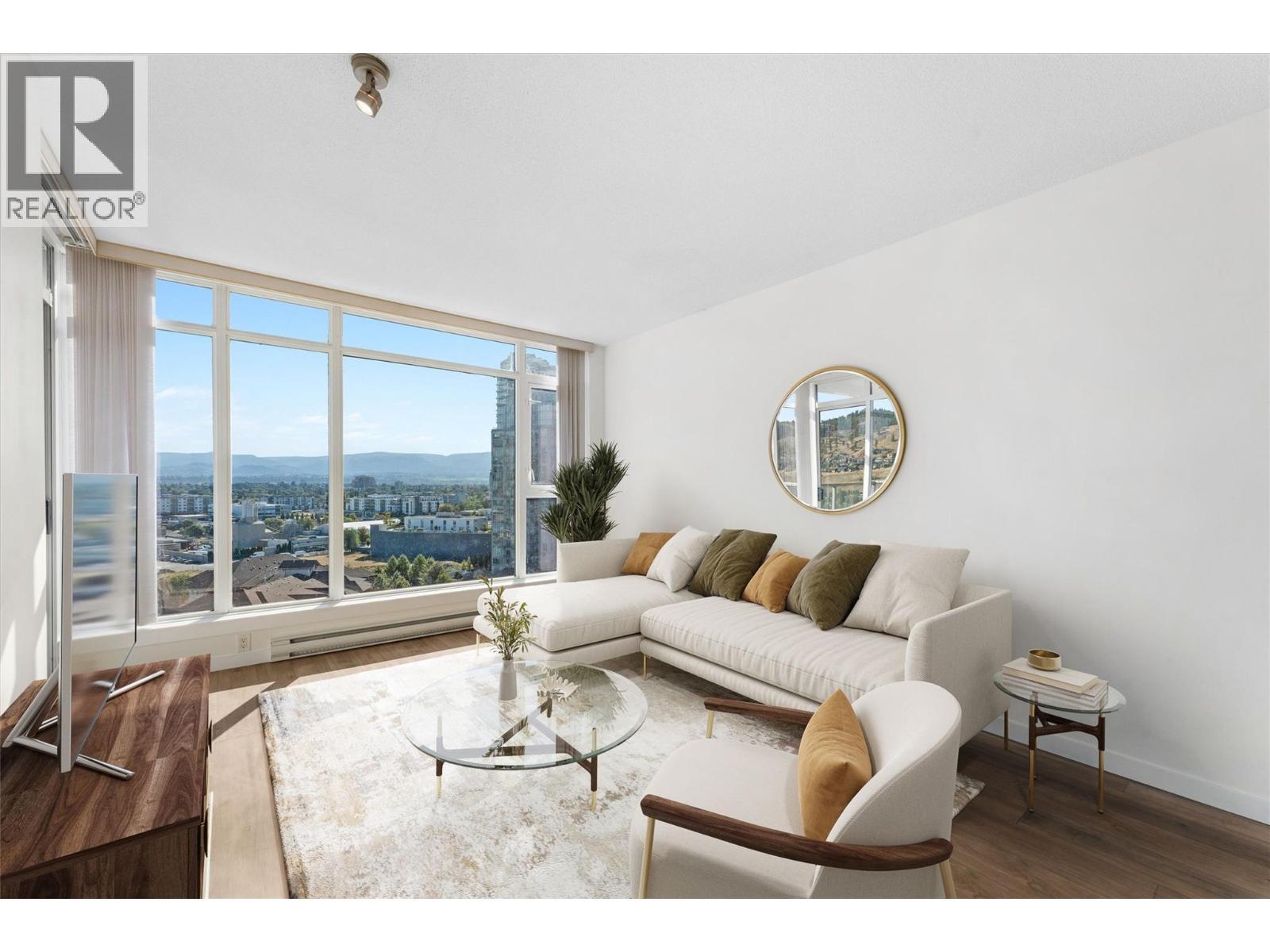 Virtually staged. - 1075 Sunset Drive Unit# 1404, Kelowna, BC - Indoor Photo Showing Living Room