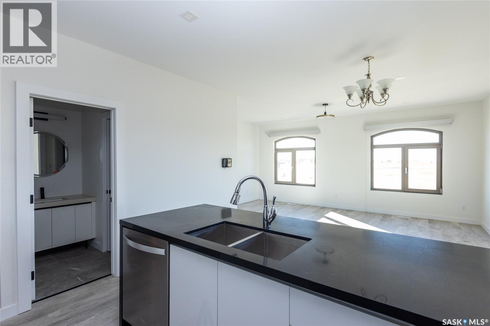 3 298 Prairie Dawn Drive, Dundurn, SK - Indoor Photo Showing Kitchen With Double Sink