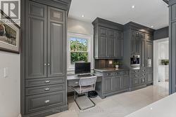 The Stunning Kitchen Features a Built-In Desk -