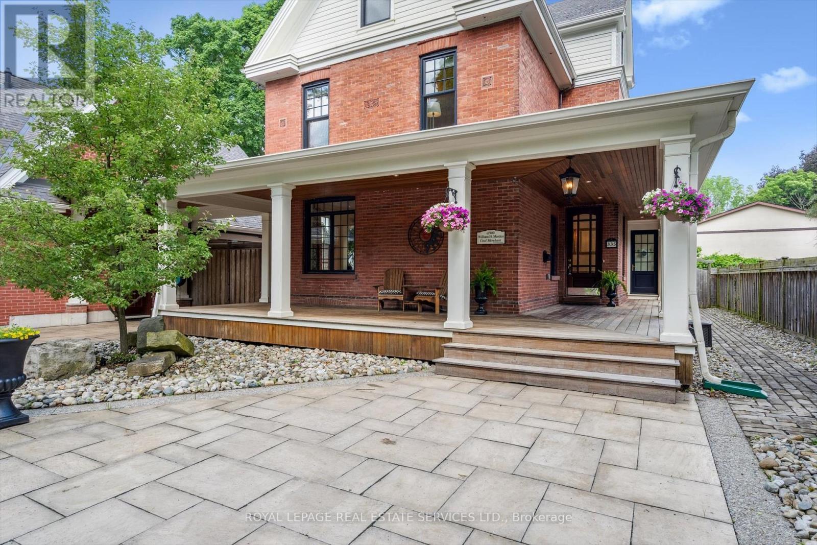 Enjoy a Charming Wraparound Porch - 335 Lakeshore Road W, Oakville, ON - Outdoor With Deck Patio Veranda