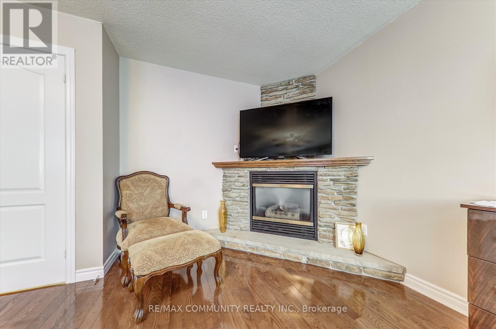 Main - 35 Hartrick Place, Whitby, ON - Indoor Photo Showing Living Room With Fireplace