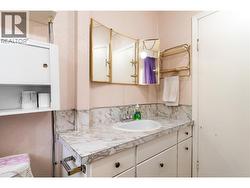 bathroom in between kitchen and dining area -