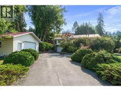 driveway, shop on right -