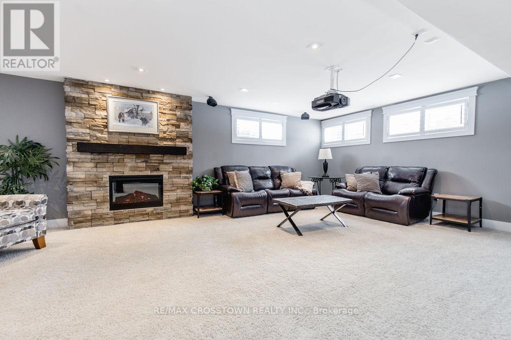 25 Mennill Drive, Springwater, ON - Indoor Photo Showing Living Room With Fireplace