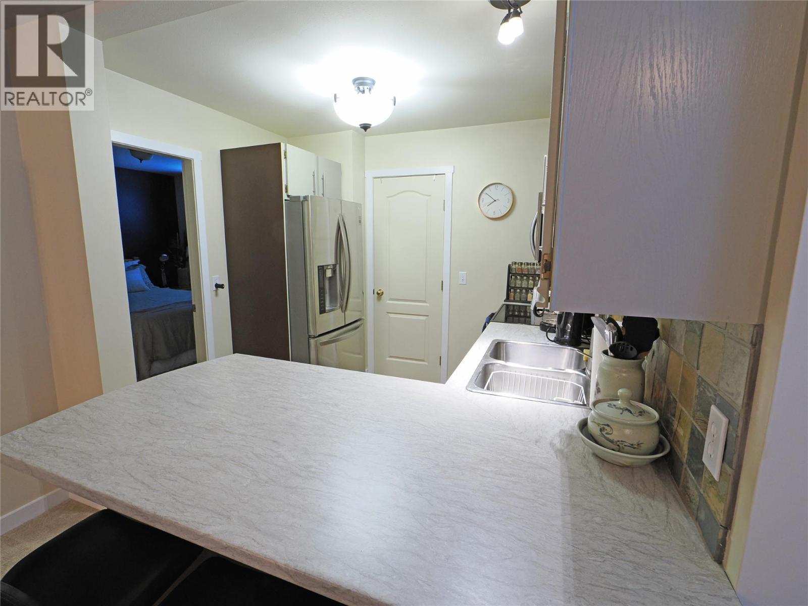 4890D Snowpines Road, Big White, BC - Indoor Photo Showing Kitchen With Double Sink