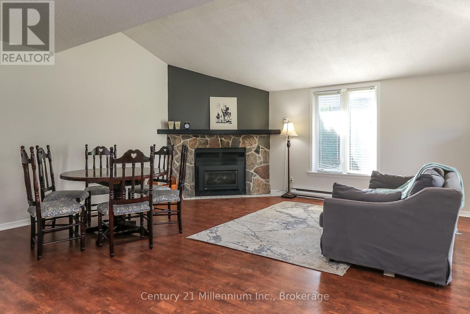 4 - 4 Trafalgar Road, Collingwood, ON - Indoor Photo Showing Living Room With Fireplace