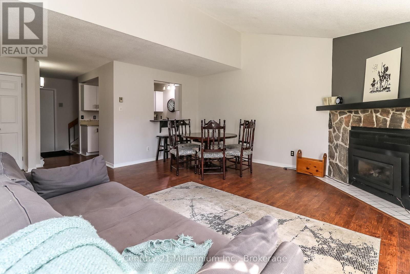 4 - 4 Trafalgar Road, Collingwood, ON - Indoor Photo Showing Living Room With Fireplace