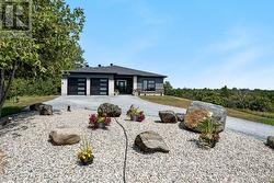 Summer view with landscaped yard -