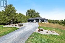 Sitting on knoll overlooking tranquil countryside -